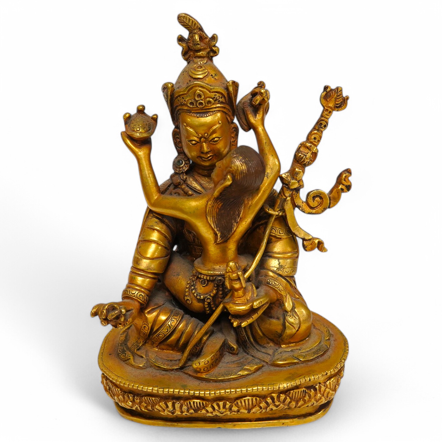 A Tibetan gilt bronze figure of a deity and consort, 15cm high. Condition - good